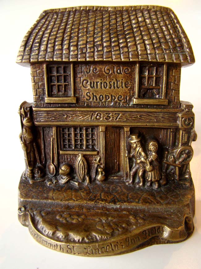 A charming pair of antique bronze bookends depicting Charles Dickens' "Old Curiosity Shoppe"